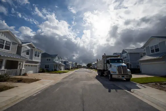 after hurricane cleanup jacksonville beach fl street fully cleared 38 properties road open dump truck final debris removal coastal neighborhood