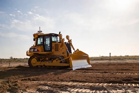 CAT D6N bulldozer clearing and grading a residential construction lot in Jacksonville, FL, to engineer spec