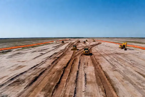 After aerial view 160 acre commercial site fully cleared graded Nassau County Florida 11 days three CAT D6N bulldozers
