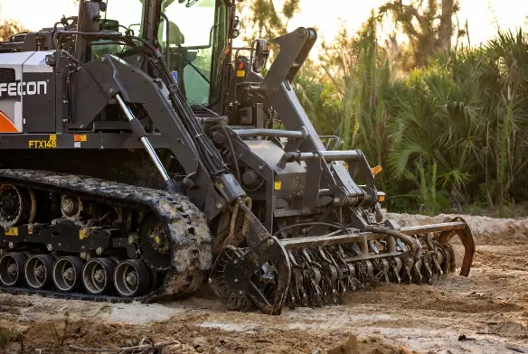 Fecon FTX148 forestry mulcher rubber track machine close up — mulching head detail, Jacksonville FL land clearing equipment